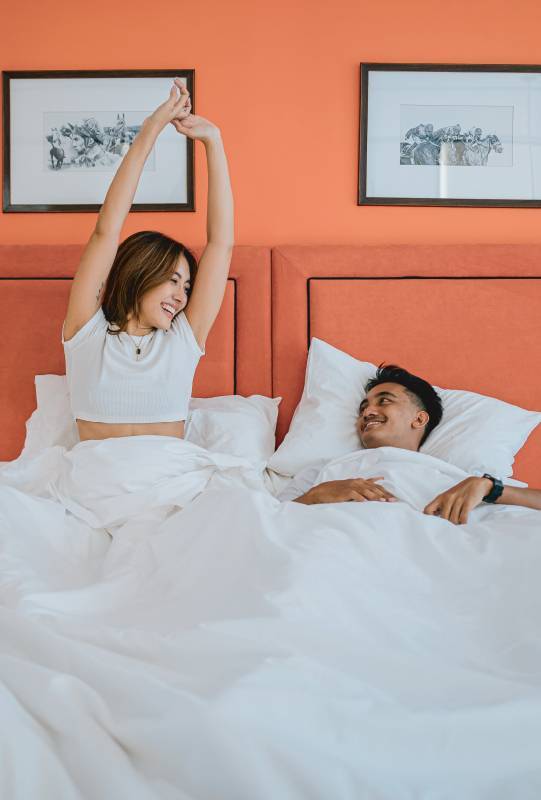 Couple waking up in a stylish Kata Beach Hotel