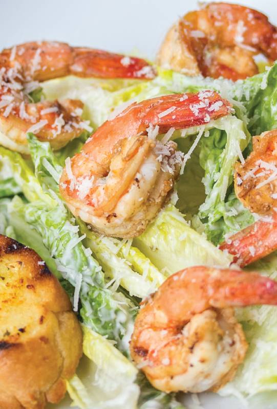 Salad with lettuce and shrimp from a healthy restaurant in Kata Phuket
